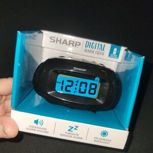Sharp digital alarm clock. New in box.